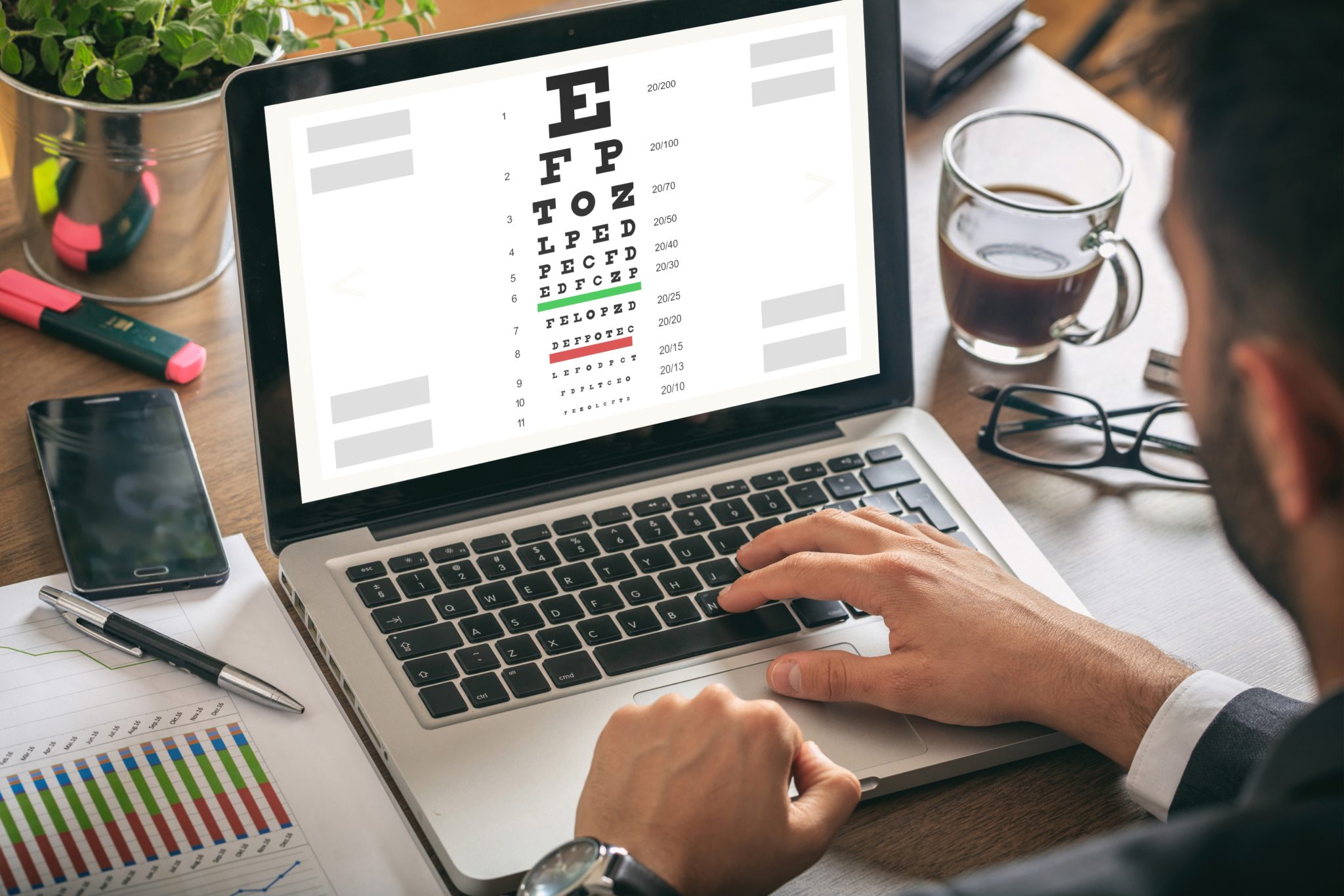 Man taking an online Snellen chart eye exam